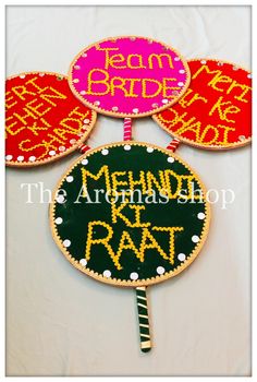 three handmade cake toppers with words on them