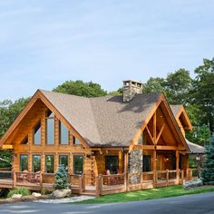 a large wooden house with a porch and balcony