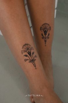 two tattoos on the legs of a woman