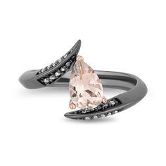 Boost the impact of your stellar ensemble with this Enchanted Disney Fine Jewelry diamond and morganite Maleficent ring. This black rhodium over sterling silver ring with black diamonds and a pale pink morganite center stone exudes Maleficent's strength of character. Expect this ring to give you not only a wicked sense of style but also the wisdom, tenacity, and courage to keep going through life's unpleasant moments. Maleficent Ring, Disney Engagement Rings, Disney Engagement, Enchanted Disney, Enchanted Disney Fine Jewelry, Disney Fine Jewelry, Black Stone Ring, Pink Morganite, Jewelry Black