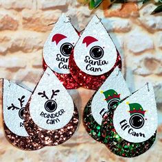 Set Of 3 Pairs Spying Christmas Cameras Glitter Faux Leather Earrings Includes One Pair Of Each: Santa Cam Elf Cam Reindeer Cam Measures: 2.5" Double Layer Single Sided Lightweight Made From Glitter Faux Leather Christmas Faux Leather Earrings Svg, Christmas Faux Leather Earrings, Reindeer Cam, Elf Cam, Handmade Jewelry Set, Santa Cam, Cricut Christmas Ideas, Sugar Skull Earrings