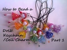 a bunch of colorful beads on top of a white surface with the words how to bead