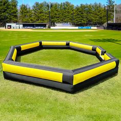 an inflatable ring on the grass with trees in the background