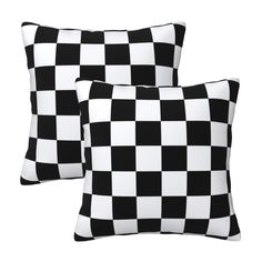 two black and white checkered pillows sitting next to each other