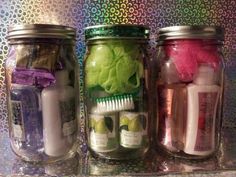 three jars filled with different types of items