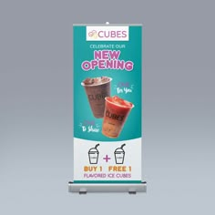 a sign advertising ice cream and drinks for cubes, with the words'celebrate our new opening'on it