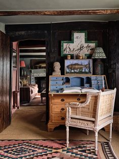 an old fashioned desk and chair in a room