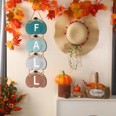 a wall with fall decorations hanging from it's sides