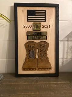 an army boot shadow box with the name and date on it