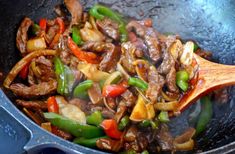 stir fry with meat and vegetables in a wok