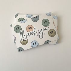 a thank you card with smiley faces on it