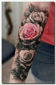 a woman's arm with roses on it