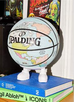 a basketball sitting on top of a stack of books