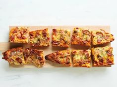 several slices of pizza on a cutting board