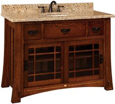 a bathroom vanity with marble top and wooden cabinet doors on both sides, under a faucet