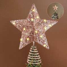 a lighted christmas tree topper in the shape of a star