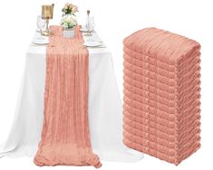 an image of a table setting with pink and white linens