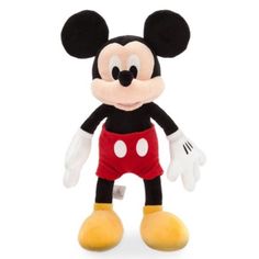 the mickey mouse stuffed animal is wearing red shorts