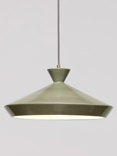 a green light hanging from a ceiling fixture