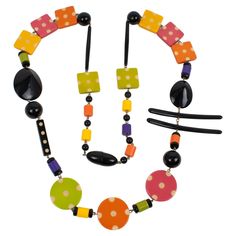 This gorgeous Angela Caputi, made-in-Italy resin and Lucite extra-long necklace has a playful design. The piece boasts geometric elements in a multicolor pattern with textures and different bead shapes. The asymmetrically constructed design features black with contrasting colors of apricot orange, avocado green, antique pink, purple, and saffron yellow. The necklace has the brand's signature snap-closing clasp. Her color matching is always extremely classy, perfect for casual or fancy occasions. As you know, Caputi jewelry is not signed. This is a pre-owned necklace, and the branded plastic tag was removed. Measurements: The necklace's total length is 42.91 in (109 cm) - The drop is 20.87 in long (53 cm) - The largest width is 3.38 in (8.5 cm) - The average width is 1.38 in (3.4 cm). Elegant Multicolor Hand Painted Necklaces, Angela Caputi Jewelry, Luxury Agate Necklace With Colorful Beads, Artistic Hand-painted Multicolor Jewelry, Unique Hand-strung Yellow Necklace, Extra Long Necklace, Antique Pink, Avocado Green, Extra Long