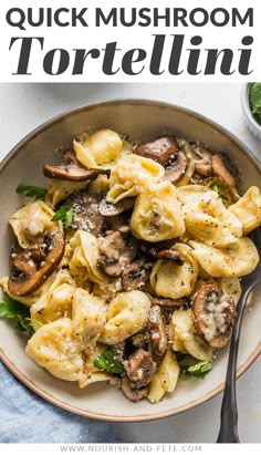 a white bowl filled with pasta and mushrooms