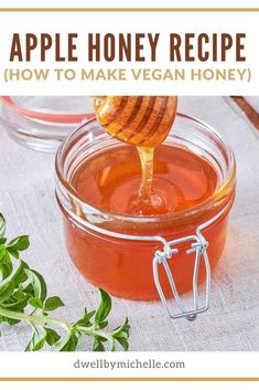 a jar filled with honey sitting on top of a table