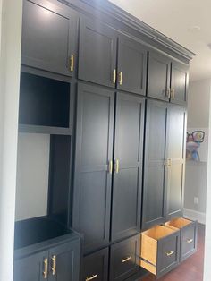 an empty room with many cabinets and drawers