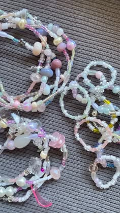 several bracelets are laid out on the floor