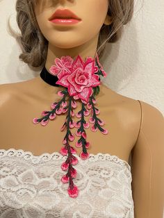 "Embroidered flower choker  Size: 16\" with 3\" extender  Flower 4.5\" by 9\"  Please let us know if you need different sizes  Returns & exchanges We don't accept returns or exchanges. But please contact us if you have any problem with your order. Request a cancellation within 24 hours of purchase The following item can't be returned or exchanged  Because  of the nature of these items, unless they arrive damaged or detective, I can't except returns for: Custom or personalized orders Perishable p Pink Choker Jewelry For Spring, Pink Choker Necklace For Spring, Spring Flower Choker Necklace, Spring Pink Choker As A Gift, Adjustable Pink Choker For Party, Pink Adjustable Choker For Party, Spring Party Pink Flower Necklace, Pink Flower Necklace, Velvet Choker Necklaces