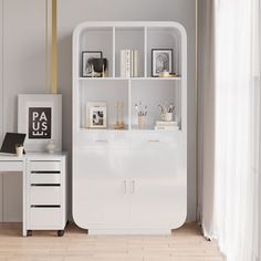 a white bookcase sitting on top of a wooden floor next to a desk and chair