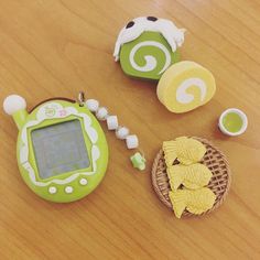 a wooden table topped with toy food and toys on top of it's surface