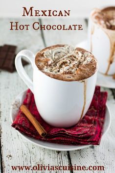 mexican hot chocolate in a white cup with cinnamon on the side