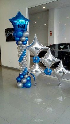 an inflatable star and balloon decoration for a car dealership