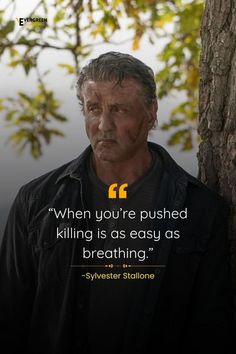 a man standing next to a tree with a quote on it saying when you're pushed, killing is as easy as breathing