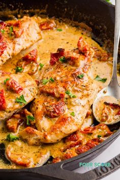 chicken with tomatoes and sauce in a skillet