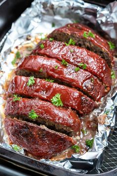 the meatloaf is covered in sauce and garnished with parsley