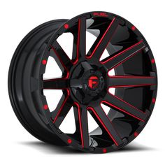 a black and red wheel with red spokes on the rim is shown in this image