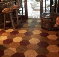 a room filled with lots of chairs and tables next to each other on top of a checkered floor