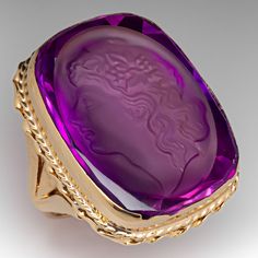 This fantastic statement ring features a laboratory grown pink sapphire intaglio, featuring a person in profile, set into a full bezel setting. The bezel is accented with twist detail. The ring measures 32.7mm at the top, rises 10.0mm above the finger, tapering to 1.7mm wide and 0.7mm thick at the base of the shank. It is currently a size 9. Antique Cocktail Ring, Old Jewelry, High Quality Jewelry, Pink Sapphire, Cocktail Rings, Modern Jewelry, Estate Jewelry, Antique Jewelry, Diamond Jewelry