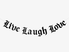 a banner that says we laugh now hanging from a string on a clothes line in front of a white background