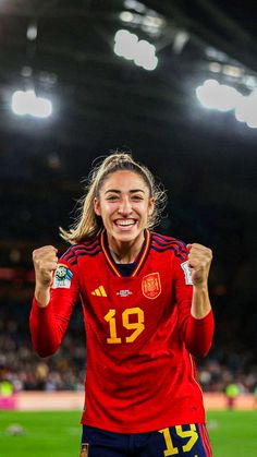 a female soccer player is celebrating her team's victory