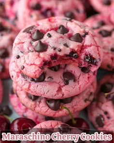 a pile of cookies with chocolate chips and cherries