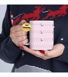 a woman holding a coffee mug with the words free shipping on it