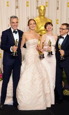 three men and two women posing with their oscars