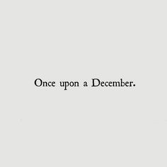 the words once upon a december written in black ink