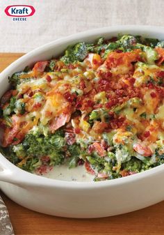 a casserole dish with broccoli, ham and cheese