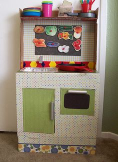 a play kitchen with lots of toys on top of it