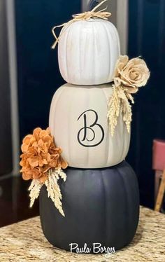 three stacked pumpkins with the letter b on them