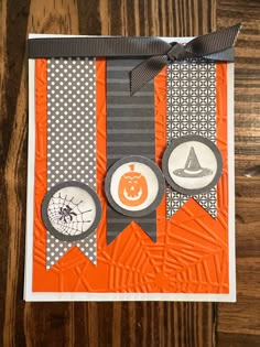 an orange and gray halloween card with buttons