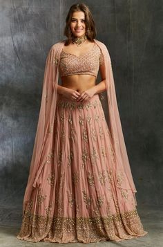 10 Mid-Range Designer Brands For Stylish And Traditional Bridal Wear Red Sequin Lehenga, Quirky Bride, Sequins Lehenga, Peach Lehenga, Sequin Lehenga, Gold Lehenga, Peach And Gold, Wedding Wardrobe, Raw Silk Lehenga